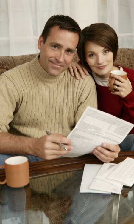Image of couple going over finances shown on the Sell an Investment Annuity page.