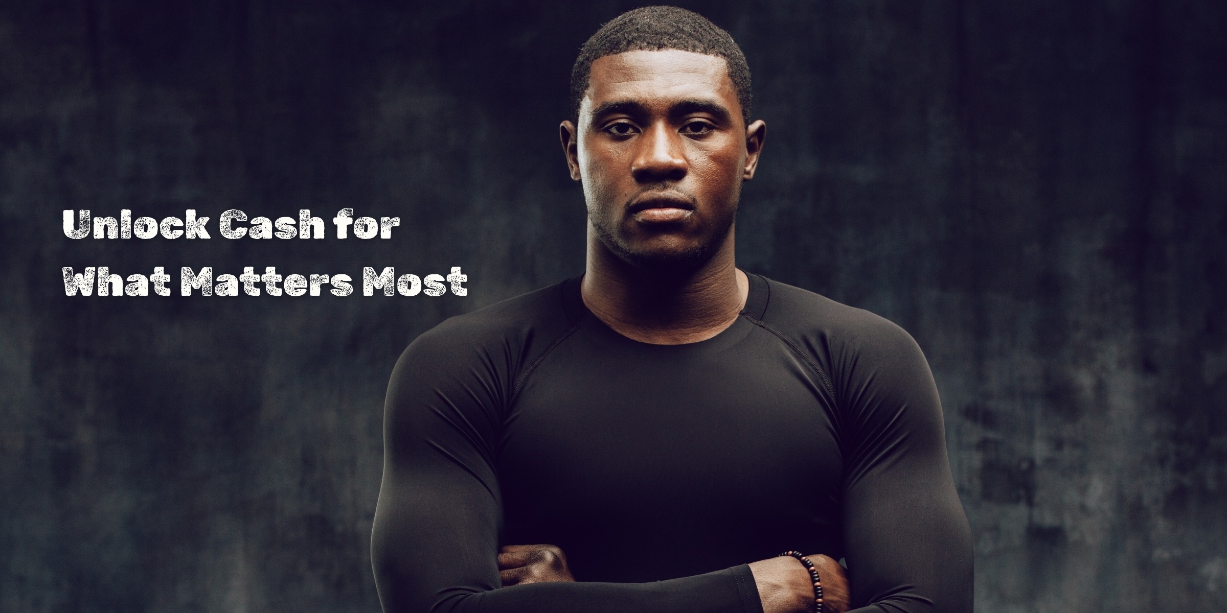 Black man in front of dark grey wall with arms folded alongside the words "Unlock Cash for What Matters Most" used as structured settlement quote homepage slider.